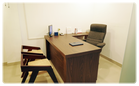 Dentist portrait at desk